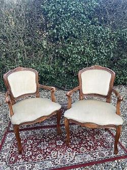 A Pair of Carved Wood French Louis Style Open Armchairs