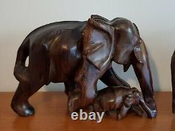 Delightful Matching Pair of Hand Carved Walnut Wood Elephants with Babies