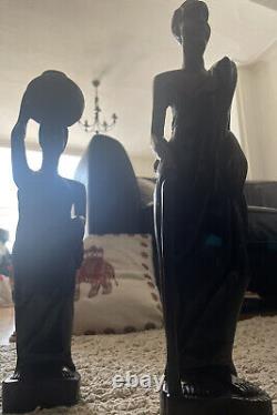 Hand carved solid wood Man & Woman. Excellent condition. Sold as a Pair
