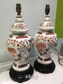 Pair Of Oriental Themed Vintage Porcelain Table Lamps On Carved Wood Bases