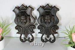 Pair antique breton wood carved black lacquered portrait heads wall plaques