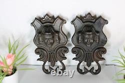 Pair antique breton wood carved black lacquered portrait heads wall plaques
