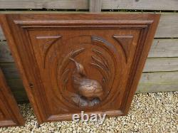 Pair antique wood carved hunting cabinet panels birds