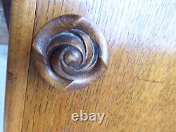 Pair of 1950's oak veneer bedside cabinets, carved rose knob, pull out shelf
