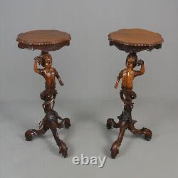 Pair of 19th Century Black Forest Carved Walnut Torcheres c. 1860