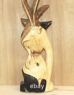 Vintage abstract hand carving wood statuette kissing couple