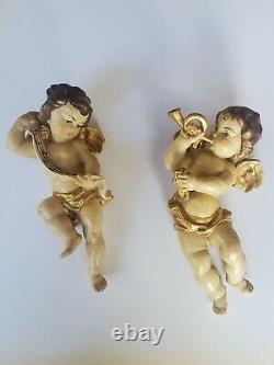 Paire de figures de putti en bois sculpté doré de style baroque italien, XIXe siècle
