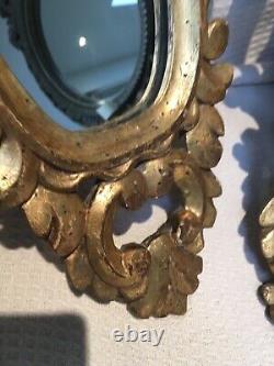 Paire de miroirs italiens anciens en bois doré sculpté 58 x 34 cm