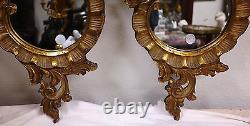 Paire de miroirs vénitiens en bois doré sculpté de style Rococo vers 1900