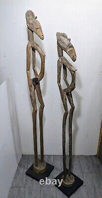 Paire de statues de couple de pilonneur de rythme Senufo africain en bois sculpté